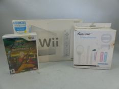 Wii games console, boxed, with accessories kit and three games