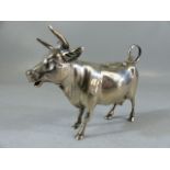 Silver Continental hallmarked 'Cow' creamer. Marked 800 to belly. The hinged lid with floral motif