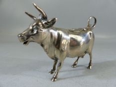 Silver Continental hallmarked 'Cow' creamer. Marked 800 to belly. The hinged lid with floral motif