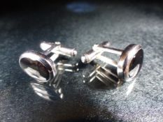Pair of silver and onyx cased cufflinks