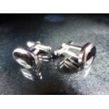 Pair of silver and onyx cased cufflinks