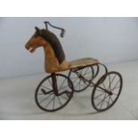 Victorian tricycle in the form of a carved wooden horse with original leather seat (A/F)