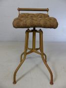 Brass adjustable machinist stool with buttoned upholstered seat