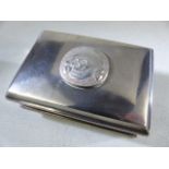 Silver cigarette/ card box marked 800 to the reverse the lid surmounted with a skull and cross bones
