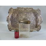 Silver coloured Repousse style tray with hallmarked silver topped bottles one clear one red labelled