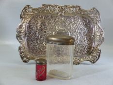 Silver coloured Repousse style tray with hallmarked silver topped bottles one clear one red labelled