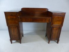 Regency sideboard in flame mahogany with original key. Twin pedestal, one with claret drawer with