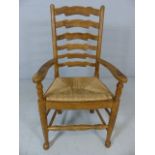 Rush-seated ladderback armchair