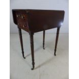 A Victorian mahogany Pembroke table, rectangular top with fall leaves, above two drawer, tapered