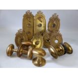 Collection of Victorian brass door furniture to include handles and single and double light