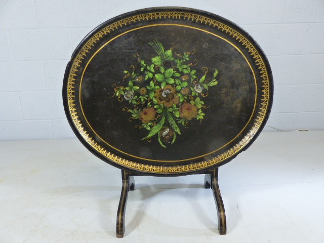 Ebonised Tilt top oval table decorated with flora and forna - Image 3 of 5