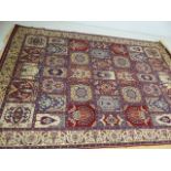 Large all-over patterned blue and red ground rug approx. 300cm x 200cm