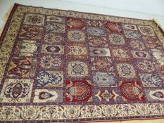 Large all-over patterned blue and red ground rug approx. 300cm x 200cm