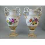 A pair of Meissen two-handled vases, with waisted necks and domed feet, with gilt borders and