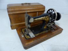 Cased vintage Frister & Rossman sewing machine