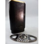Brass and leather cigar holder and a cigar cutter