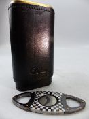 Brass and leather cigar holder and a cigar cutter