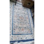 Blue and beige ground multi coloured floral patterned tasselled Chinese rug (72" x 48")