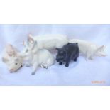 Four Beswick pig ornaments including two boars, sow with puppy,