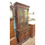Early 20th century display cupboard the upper fitted two rectangular glazed panels with display
