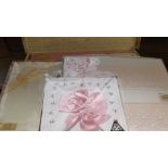 6 unopened boxes of linen incl. pink sheets, table cloths, pillow cases etc.