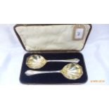 Pair of scallop shell plated salad servers in original brown leather box,