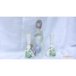 Nao Lladro figure of a young girl carrying a bonnet and holding a bunch of flowers,