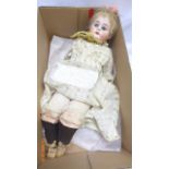 Small early 20th century American bisque head doll, fixed blue eyes,