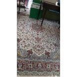 Multi coloured floral patterned blue beige and red ground tasselled carpet (115" x 80")