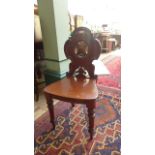 18th century mahogany hall chair the carved back with circular and triangular inset