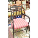 Black painted armchair with five vertical sticks to back,