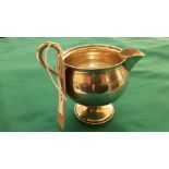 Sterling silver cream jug on circular plinth (2 3/4 oz)