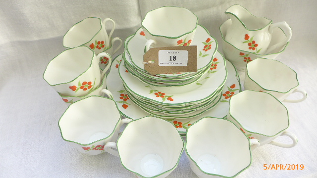 White ground hand painted bone china part tea set with apple green border and orange floral sprays