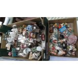 A large and small box of miniature dolls, prams, bicycles, dolls house furniture etc.