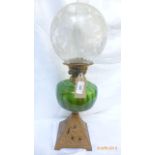 Brass shaped base early 20th century oil lamp with dark green bowl and domed etched clear glass