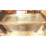 Antique oak panelled blanket chest with three carved panels to front