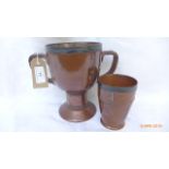 Doulton Lambeth silicon double handled trophy vase and matching beaker.