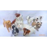 9 Dog ornaments from various factories principally Beswick