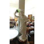 Plaster figure of a maiden holding converted torch electric light (48" high)