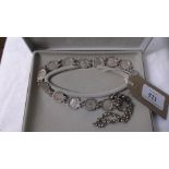 Ladies necklace containing fourteen George V silver threepenny pieces