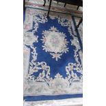 Blue and beige ground tasselled coloured floral patterned Chinese rug in similar style (72" x 48")