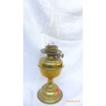Early 20th century brass oil lamp with shaped glass flue