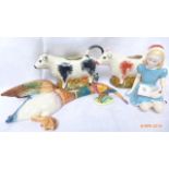 Pair of Chelsea Burslem creamers, pheasant ornament,