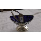 Pierced handled boat shaped Georgian style silver sweetmeat basket with cobalt blue glass liner