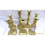 Six individual brass candlesticks