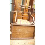 Oak framed folding chair with canvas seat and a brass handled oak tray