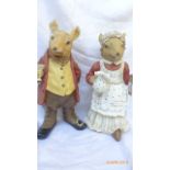 Two Beatrix Potter figurines of Grandma and Grandpa rabbit in similar style