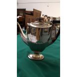 Decorative fluted plated coffee pot with black handle and oval bean tip to lid
