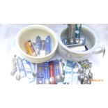 Blue and white gazunda and another both containing a selection of presentation spoons,