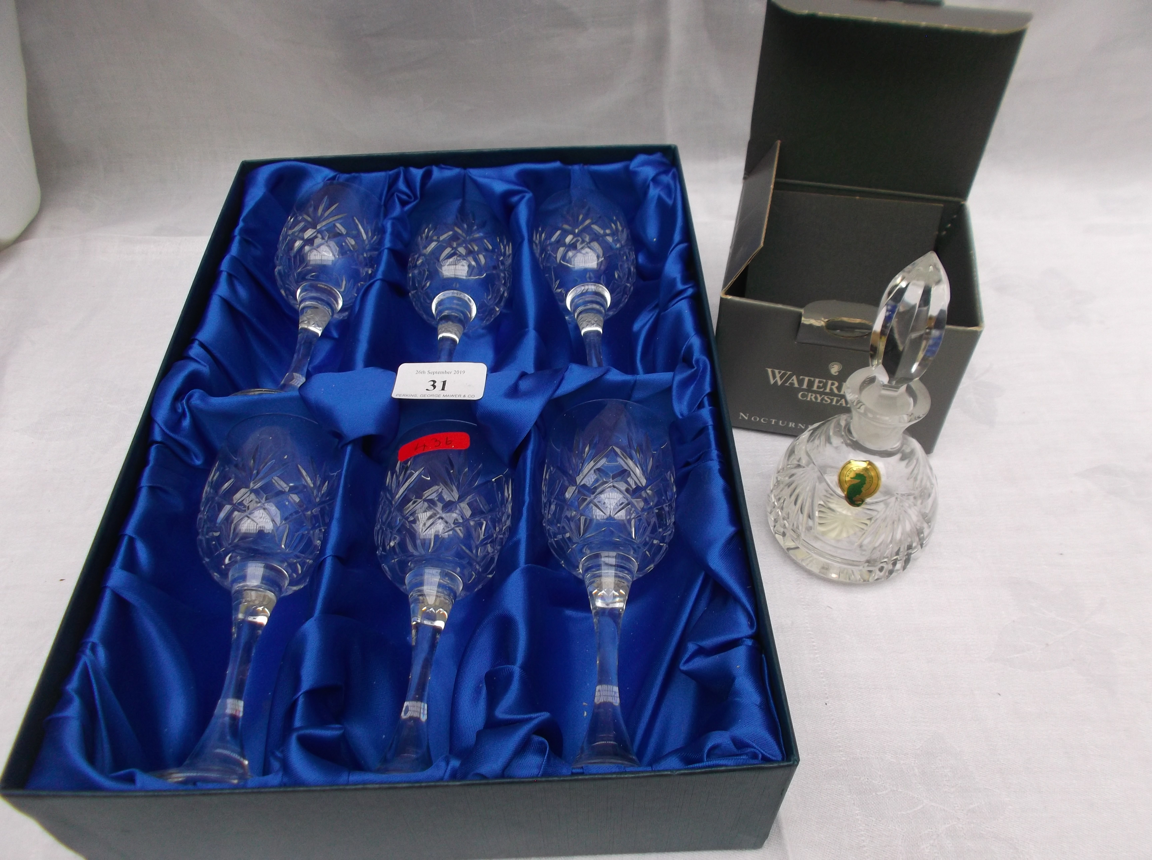 Boxed unused set of 6 crystal wine goblets and an unused Waterford Crystal perfume bottle